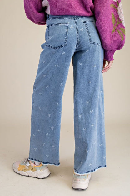 BOW PRINTED STRETCH DENIM PANTS