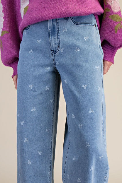 BOW PRINTED STRETCH DENIM PANTS